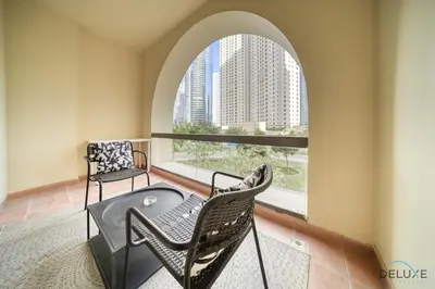 a balcony with a table and chairs and a window at Serene 1BR at Murjan 2 JBR by Deluxe Holiday Homes in Dubai
