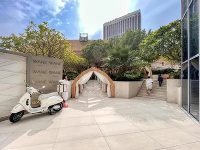 a white scooter parked in a courtyard with a tunnel at Welcome Home at The Address Marina 1BR in Dubai