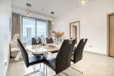a dining room with a table and chairs at Stella Maris, Dubai Marina - Mint Stay in Dubai
