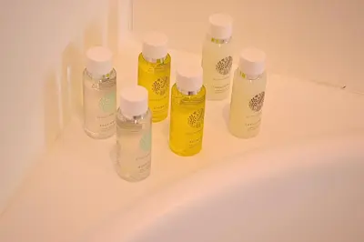 a group of bottles sitting on top of a bath tub at Perfect 1 Bedroom Boulevard,Fountain & Opera View in Dubai