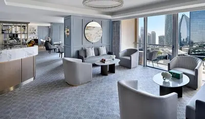 a living room with a couch and chairs and a table at OSTAY -Address Dubai Mall - The Residence in Dubai