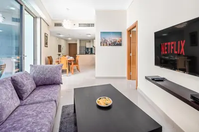 a living room with a couch and a table at Breathtaking sea-view condo in Dubai Marina - Palm Views! in Dubai