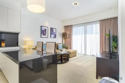 a living room with a couch and a table at Ornate 1BR in The Address Residences Dubai Marina by Deluxe Holiday Homes in Dubai