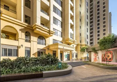 a large apartment building with a courtyard in front of it at Spacious 2BD in Amwaj JBR near the beach in Dubai