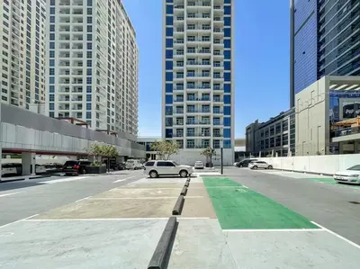 a parking lot in a city with tall buildings at Funky STUDIO Dubai Marina outstanding facilities in Dubai