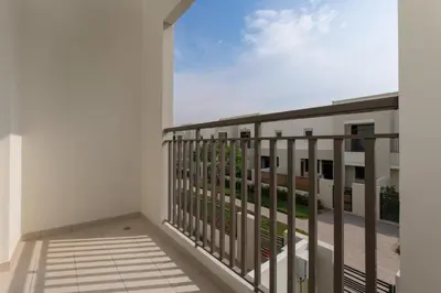 a balcony with a view of a building at Stunning 4 bedroom townhouse in Townsquare in Dubai