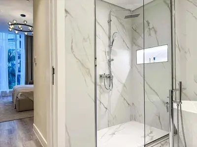 a shower with a glass door in a bathroom at Sunset view apartment in Oceana in Dubai