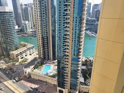 an aerial view of a city with tall buildings at USMANS 5 BEDROOM APARTMENT at JBR WALK RIMAL ON THE BEACH 2750 SFT HUGE Direct Beach Access Fully Serviced JBR in Dubai