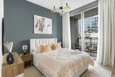 a bedroom with a bed and a balcony at GuestReady - Contemporary with Ain Dubai View in Dubai