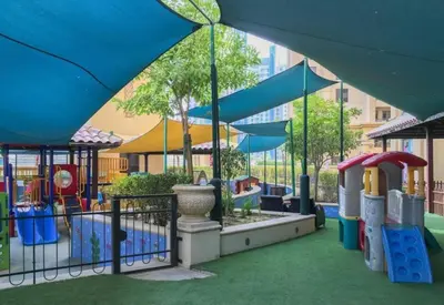 a park with a playground with a slide at 360 Vacation - Spacious 3BR Close to the Beach I Rimal1 JBR in Dubai