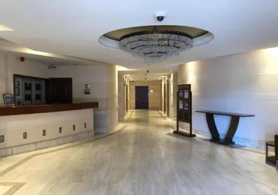 a large empty room with a large chandelier on the ceiling at 360 Vacation - Spacious 3BR Close to the Beach I Rimal1 JBR in Dubai