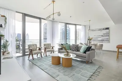 a living room with a couch and a table at Frank Porter - Stella Maris in Dubai