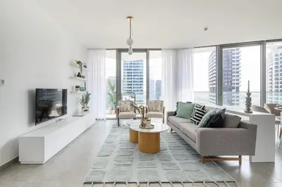 a living room with a couch and a table at Frank Porter - Stella Maris in Dubai