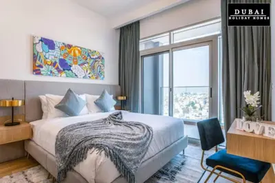 a bedroom with a bed and a large window at 151 Residence Jumeirah Gardens in Dubai