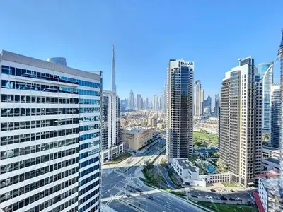 an aerial view of a city with tall buildings at Vacationer l Bright Studio l Burj Khalifa View l Business Bay in Dubai