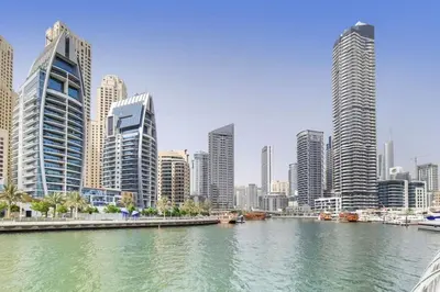 a river in a city with tall buildings at Vacationer I Sparkle T1 2 Bedroom I Marina Views I Steps away from Beach I Gym, Pool, Parking & Wi-Fi in Dubai