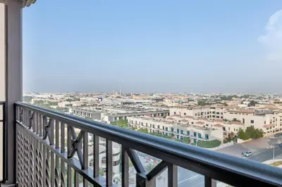a balcony with a view of a city at Stylish 1 Bedroom Apartment Near Burj Al Arab (Madinat Jumeirah) in Dubai