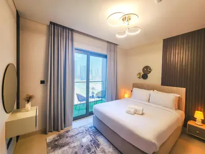 a bedroom with a large bed and a large window at STAY BY LATINEM Luxury 2BR Holiday Home CV B2302 near Burj Khalifa in Dubai