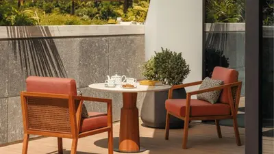 two chairs and a table on a patio at Jumeirah Residences Marsa Al Arab Dubai in Dubai