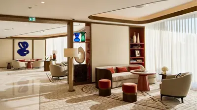 a living room with a couch and a table at Jumeirah Residences Marsa Al Arab Dubai in Dubai