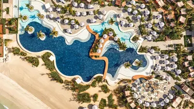 an aerial view of a pool at a resort at Jumeirah Marsa Al Arab Dubai in Dubai