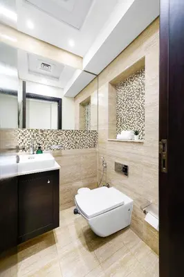 a bathroom with a toilet and a sink at Bright & Vibrant 2BR+kids room 7min to Dubai Mall in Dubai