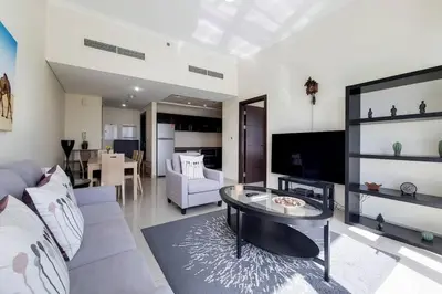 a living room with a couch and a table at Bay Central, Dubai Marina - Peaceful One Bedroom in Dubai