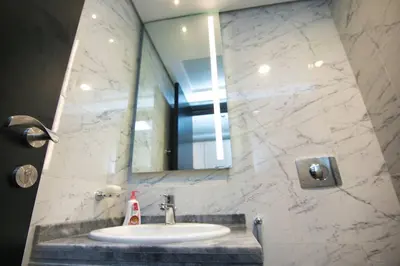 a bathroom with a sink and a mirror at Exceptional Furnished Studio in Dubai