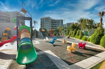 a playground with children playing on a slide at Exceptional Furnished Studio in Dubai