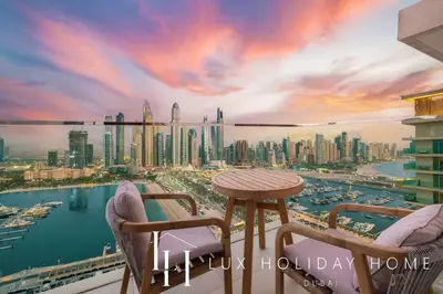 a balcony with a view of a city skyline at LUX The Luxury Sunrise Beachfront Suite 1 in Dubai