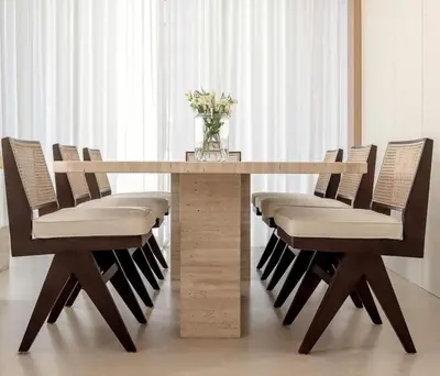 a table with chairs and a vase of flowers on top at Luxurious 3BR Maid room 33rd Floor Marina Gate in Dubai