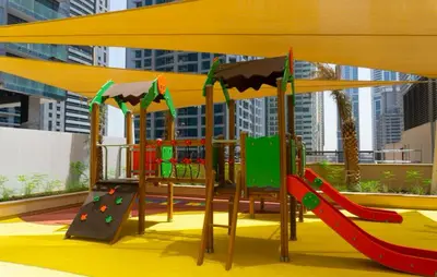 a playground with a slide and a slideintend at StoneTree - Marina Gate 2 BR - Partial Sea View in Dubai