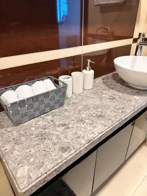 a bathroom with a sink and a counter with a sink at Stylish 1 BR with sea view - Sunset view in Dubai