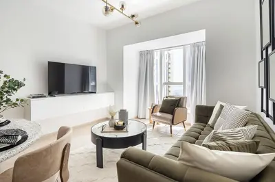 a living room with a couch and a table at Frank Porter - Elite Residence in Dubai