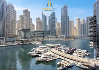 a group of boats docked in a harbor in a city at One Bed in Dubai Marina with Marina Views, Hosted by Desert City Stays in Dubai