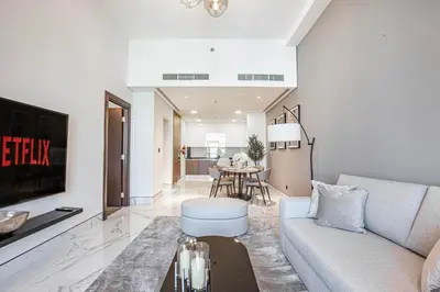 a living room with a couch and a table at Daniels Canal View 1BR at J One Business Bay in Dubai