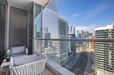 an apartment balcony with a view of a city at Daniels Canal View 1BR at J One Business Bay in Dubai