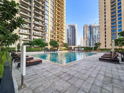 a swimming pool in the middle of a city with buildings at Incredible Waterfront Apt with Panoramic Views in Dubai