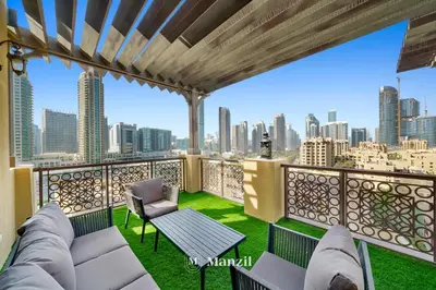 a balcony with a view of the city at Manzil - Cozy 2BR Penthouse with Private Terrace and Full Burj View in Downtown in Dubai