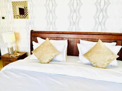 a bedroom with a bed with white sheets and pillows at Luxury Casa - Indigo Sea View Apartment JBR Beach 2BR in Dubai