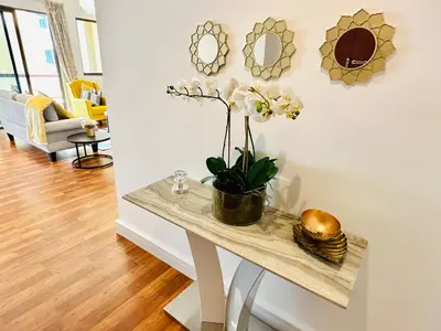 a living room with a table with a plant on it at Luxury Casa - Indigo Sea View Apartment JBR Beach 2BR in Dubai