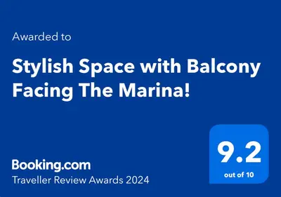a blue screen with the text swollen space with bakery facing the marina at Stylish Space with Balcony Facing The Marina! in Dubai
