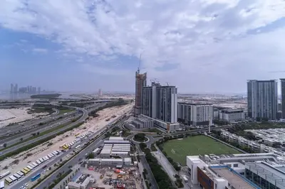 an aerial view of a city with traffic and buildings at Intimate Apartment with Scenic View of Dubai Creek in Dubai