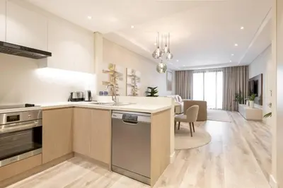 a kitchen with a sink and a counter top at Upgraded Gorgeous 1BR at 5 Star Resort in Dubai