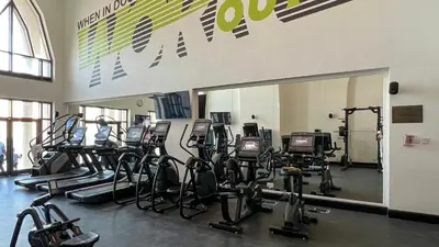 a gym with a bunch of exercise bikes in it at Luxurious Unique 2 Bed with Private Jacuzzi & Garden - Connected to Souk Al Bahar - Dubai Mall in Dubai