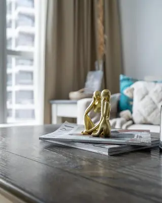 two little figurines on a table in a living room at GuestReady - Exquisite getaway with Marina views in Dubai