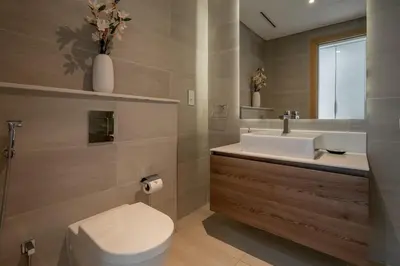 a bathroom with a toilet and a sink at GuestReady - Luxurious Accents near Burj Khalifa in Dubai