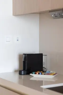 a microwave on a counter with a plate of food at Palm Tower St. Regis Amazing view high-end Studio in Dubai