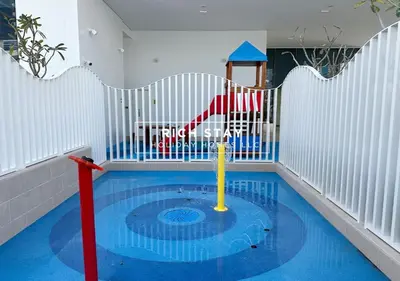 a childs play area with a pool in a room at Grande 3BR in Stella Maris, Sea View, Dubai Marina in Dubai