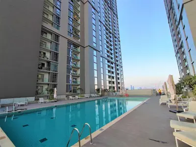 a swimming pool in the middle of a building at Perfect 1 BR for Family Stay - Close to Downtown in Dubai
